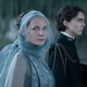 Rebecca Ferguson as Lady Jessica in Denis Villeneuve's Dune, staring at an off-screen Oscar Isaac with Timothée Chalamet in the background.